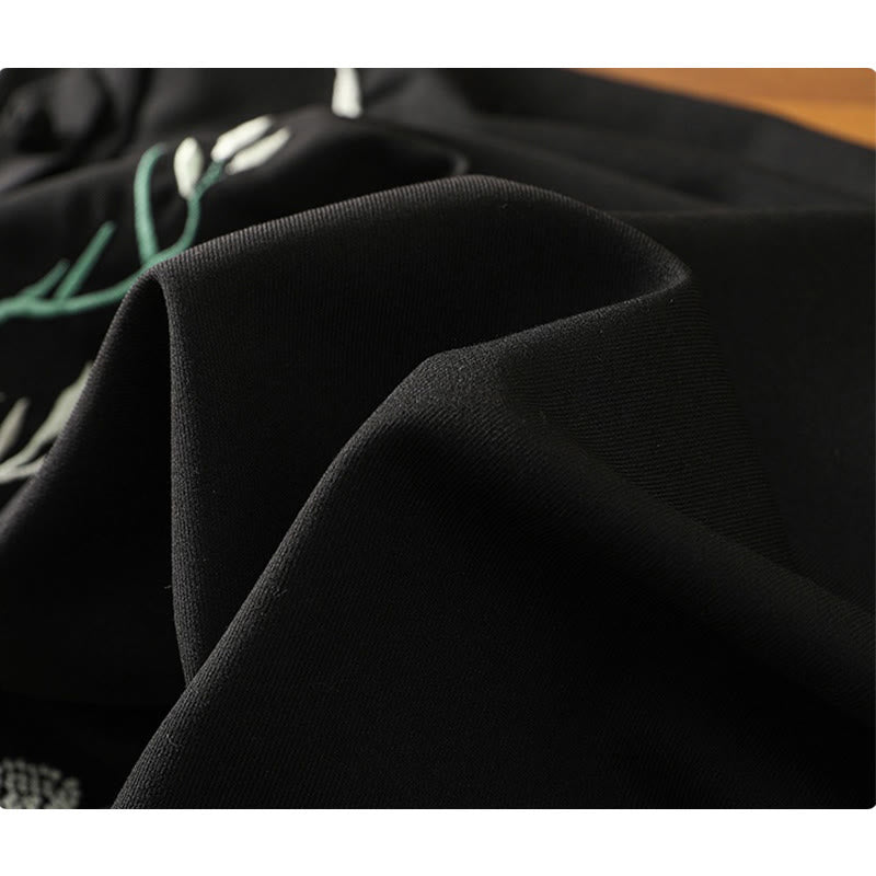 Ensemble chemise à pompons et fleurs brodées avec jupe à imprimé floral