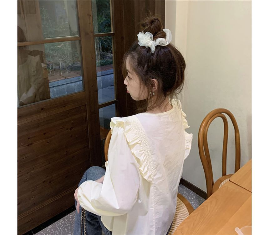 Chemisier uni à encolure dégagée et bordure à volants