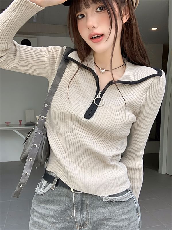 Haut en tricot à demi-fermeture éclair et bordure contrastante