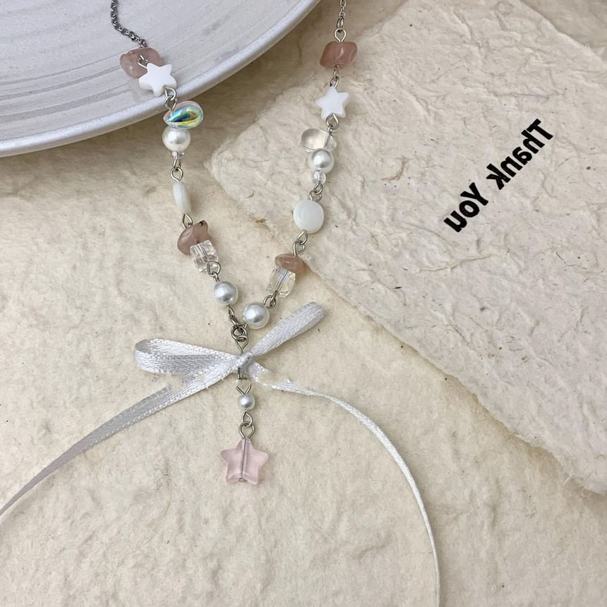 Collier de perles en fausses perles avec nœud W732