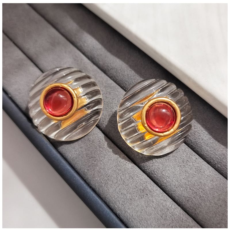 Clous d'oreilles en acrylique