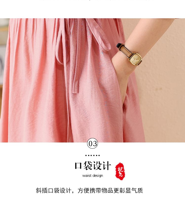 Robe trapèze mi-longue unie à col cranté et manches aux coudes avec nœud papillon