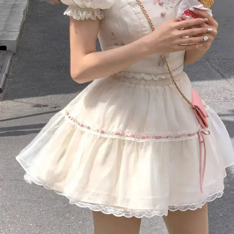 Tenues avec haut et robe rose doux