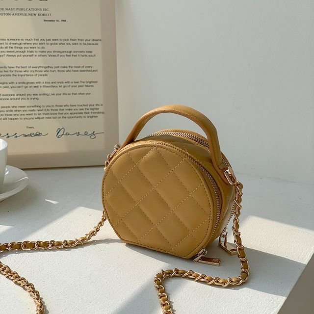 Sac bandoulière rond matelassé en similicuir