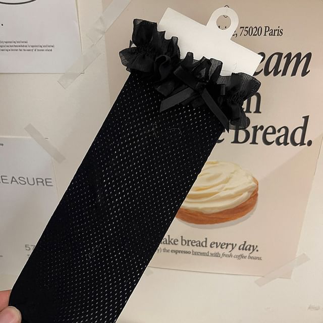 Chaussettes perforées à bordure volantée et nœud