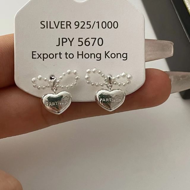 Boucles d'oreilles pendantes en forme de cœur avec nœud en fausses perles