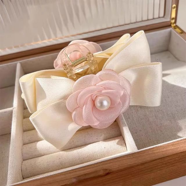 Pince à cheveux avec nœud en fausses perles et motif floral