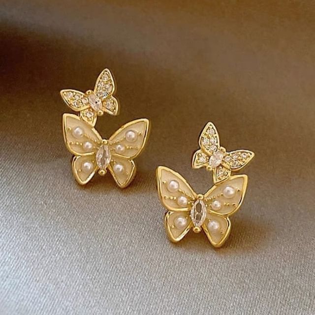 Clous d'oreilles papillon en fausses perles et strass