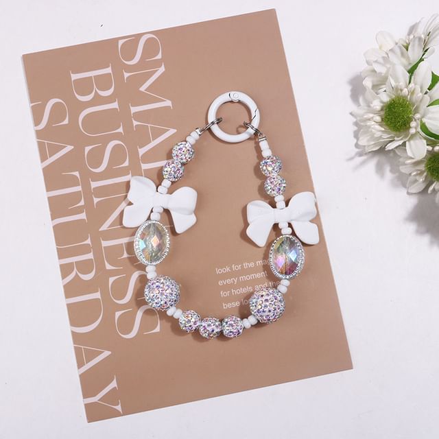 Bijou de sac en résine avec nœud et strass (différents modèles)