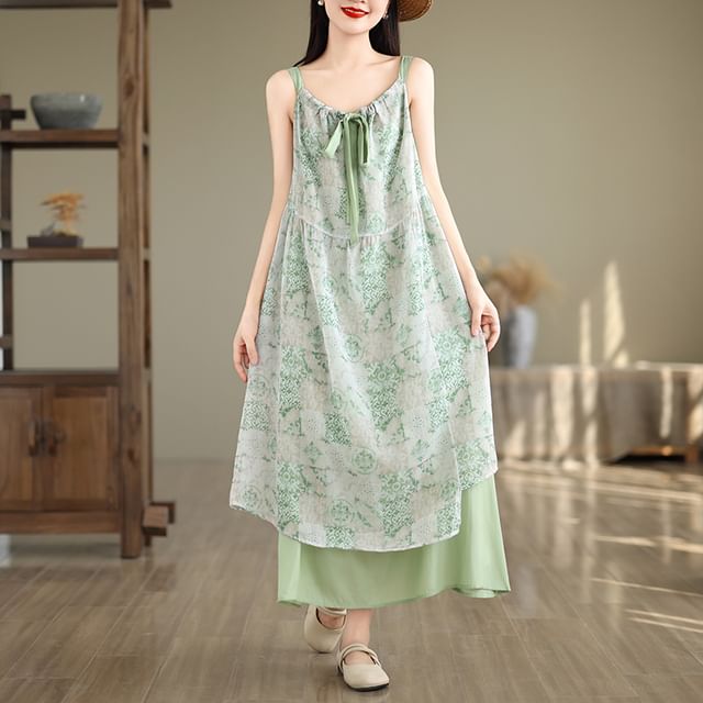 Robe trapèze longue sans manches à imprimé à motifs et col en V avec lien sur le devant