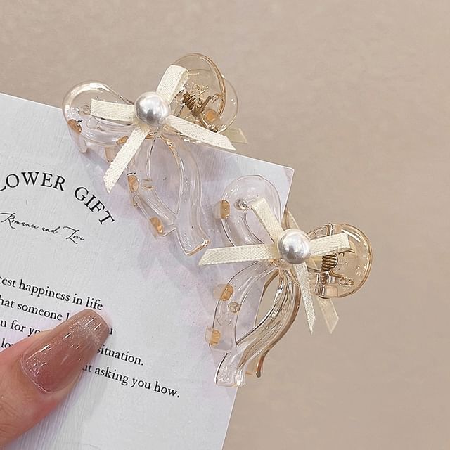 Lot de 2 : Pince à cheveux en forme de nœud avec fausses perles