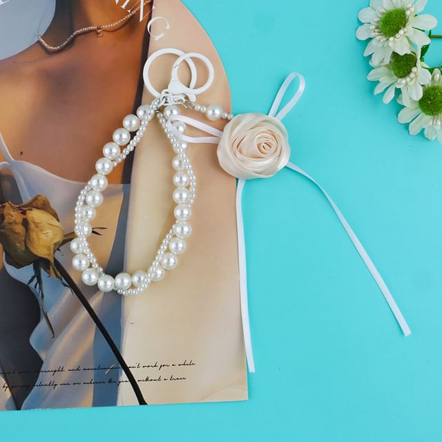 Porte-clés en fausses perles avec ruban rose