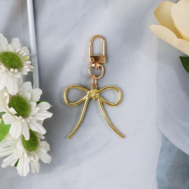 Porte-clés de téléphone avec nœud/perle (différents modèles)