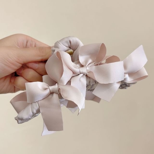 Pince à cheveux en forme d'arc