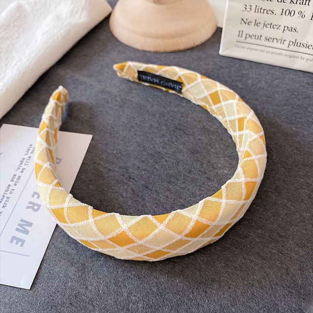 Bandeau rembourré à carreaux