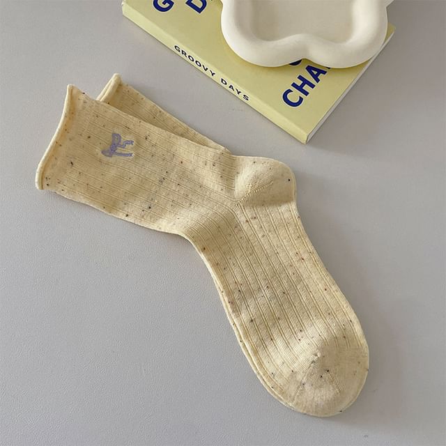 Chaussettes côtelées brodées avec nœud