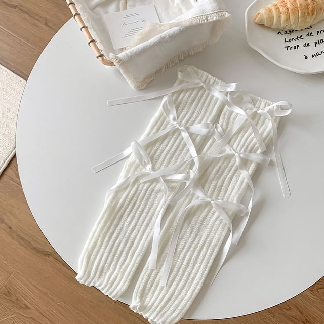 Jambières en tricot côtelé avec ruban