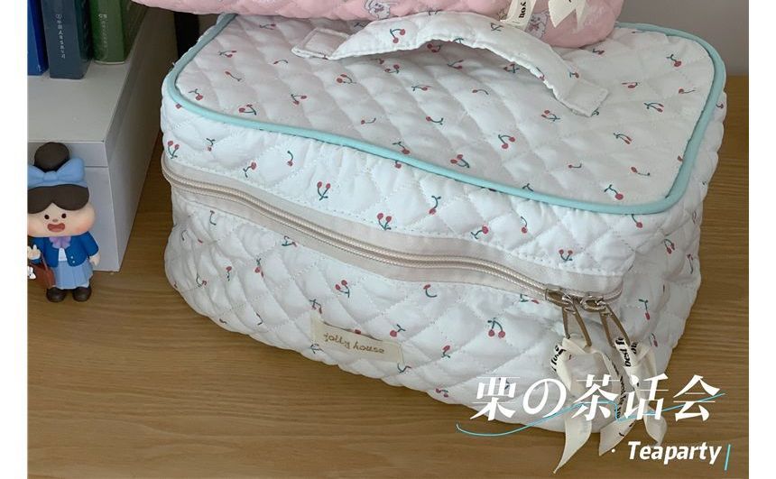 Trousse de maquillage matelassée à motifs