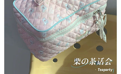 Trousse de maquillage matelassée à motifs