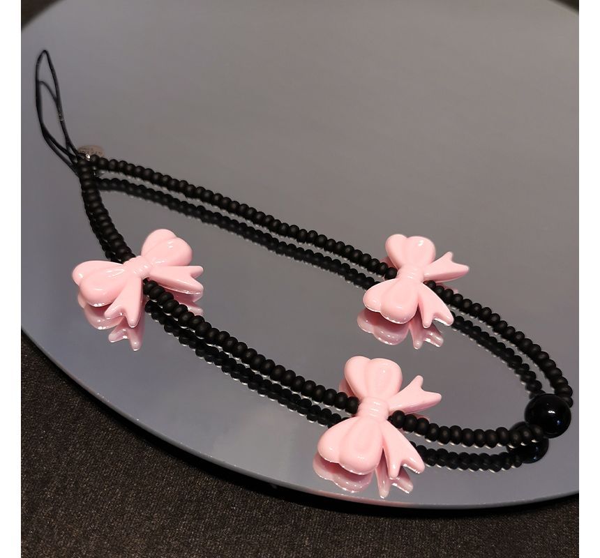 Sangle de téléphone en perles avec nœud