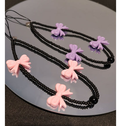 Sangle de téléphone en perles avec nœud