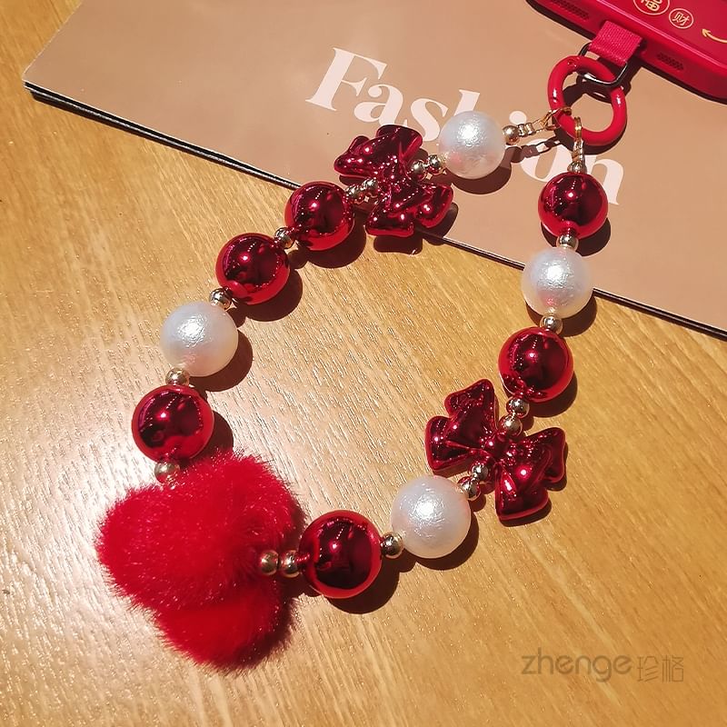 Dragonne de téléphone avec pompon et fausses perles et coussinet pour cordon