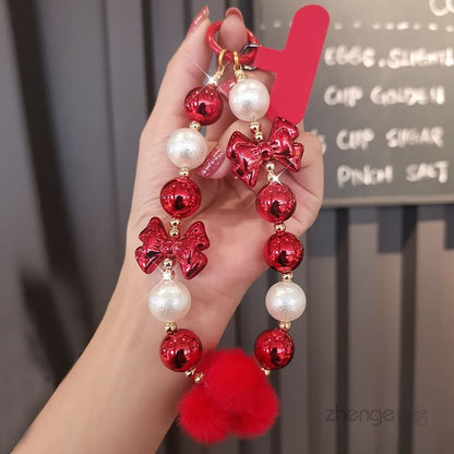 Dragonne de téléphone avec pompon et fausses perles et coussinet pour cordon