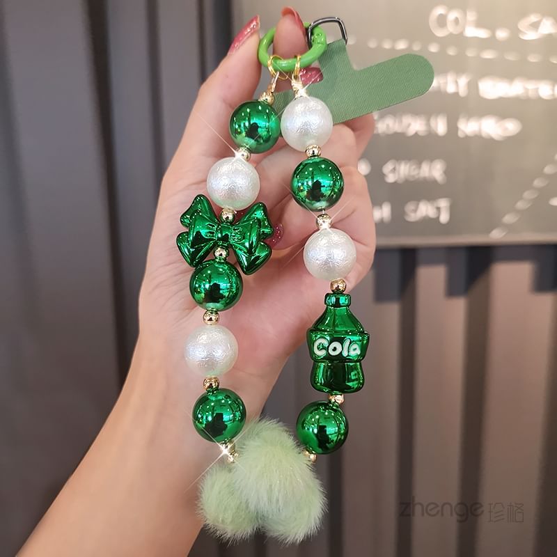 Dragonne de téléphone avec pompon et fausses perles et coussinet pour cordon