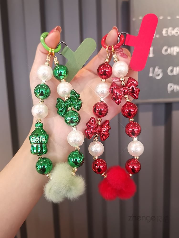 Dragonne de téléphone avec pompon et fausses perles et coussinet pour cordon