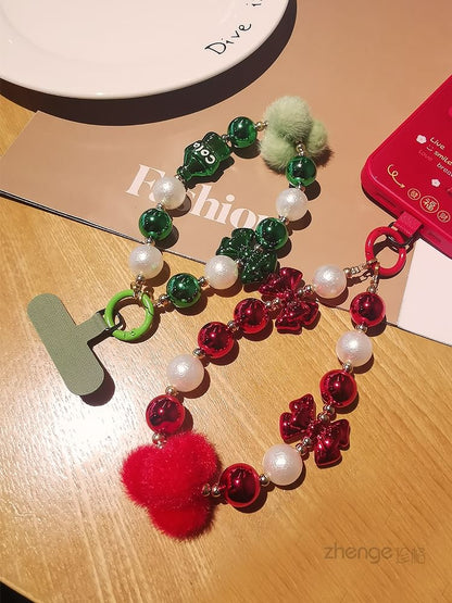 Dragonne de téléphone avec pompon et fausses perles et coussinet pour cordon