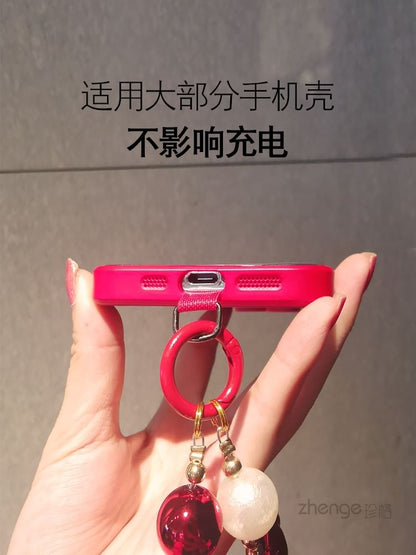 Dragonne de téléphone avec pompon et fausses perles et coussinet pour cordon