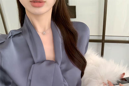 Chemisier uni à manches longues et col noué