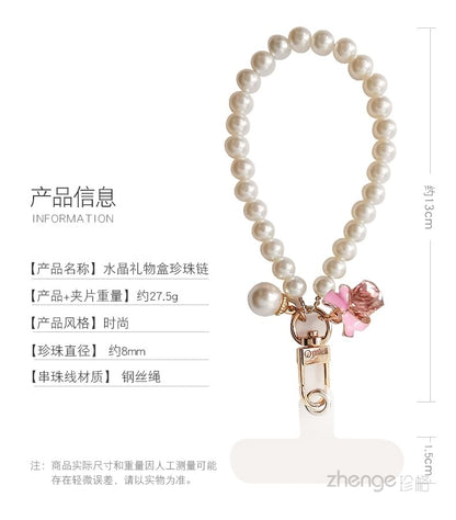 Dragonne de téléphone avec nœud en fausse perle et coussinet pour cordon