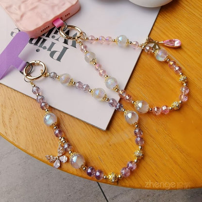 Dragonne de téléphone en faux cristal avec coussinet pour cordon