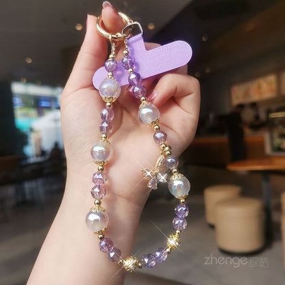 Dragonne de téléphone en faux cristal avec coussinet pour cordon