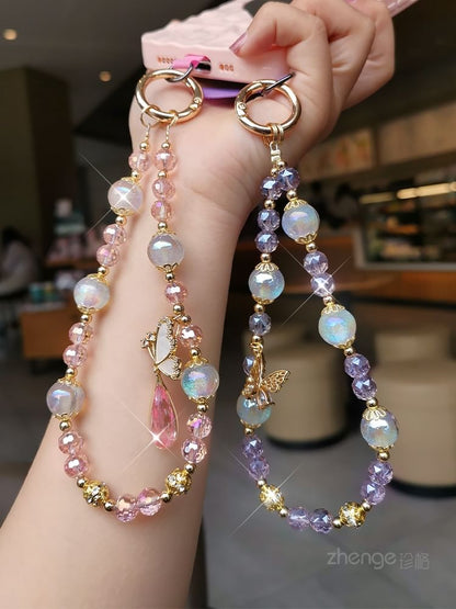 Dragonne de téléphone en faux cristal avec coussinet pour cordon