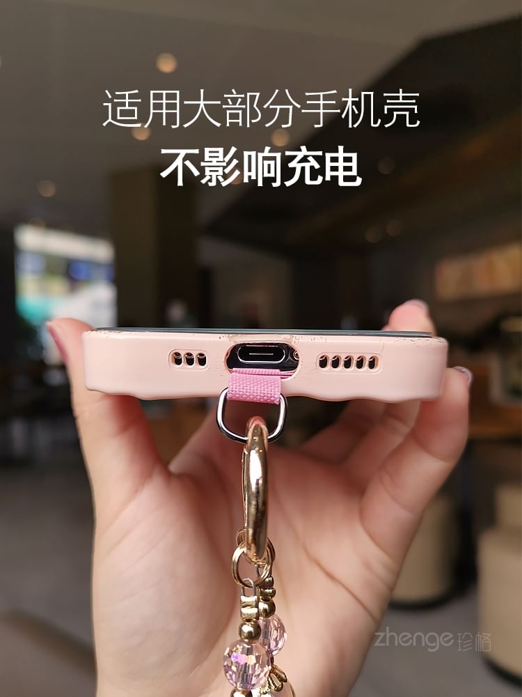 Dragonne de téléphone en faux cristal avec coussinet pour cordon