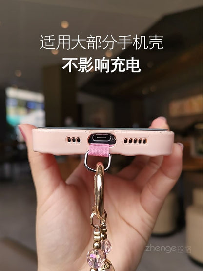 Dragonne de téléphone en faux cristal avec coussinet pour cordon