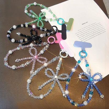 Dragonne de téléphone avec nœud en faux cristal et coussinet pour cordon