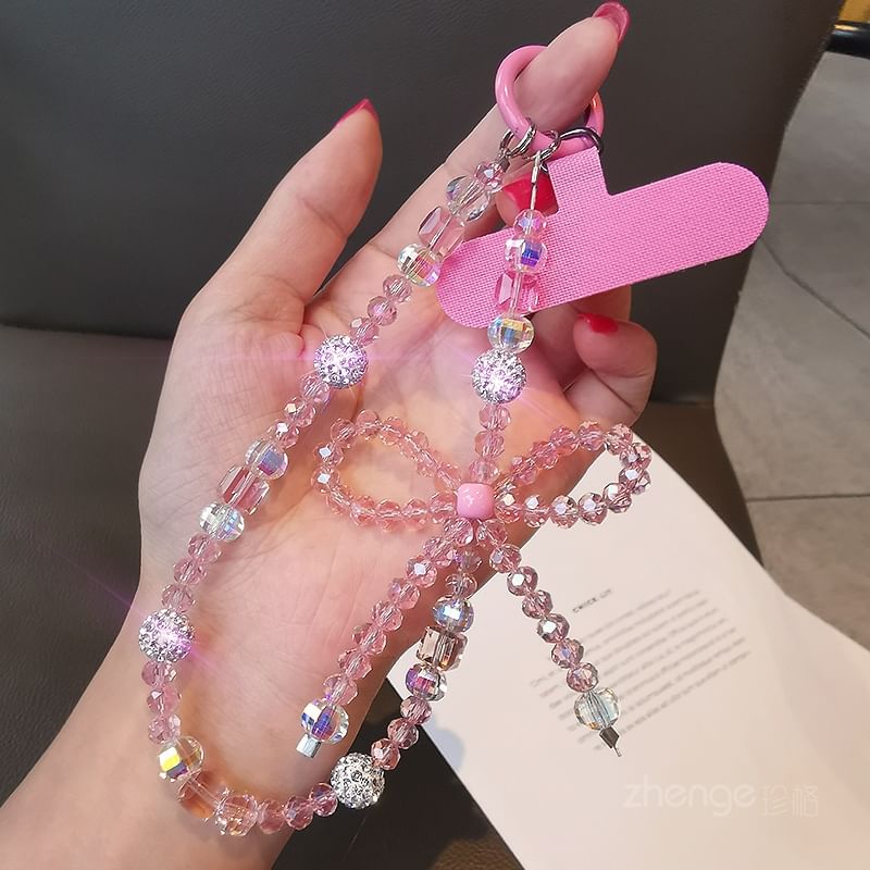 Dragonne de téléphone avec nœud en faux cristal et coussinet pour cordon