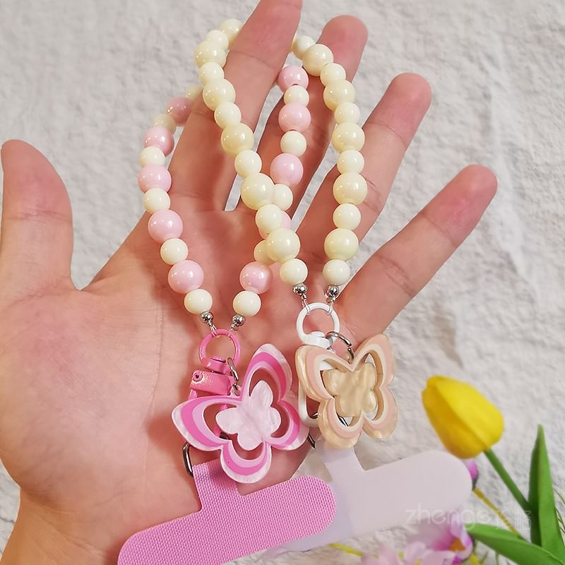 Dragonne de téléphone en perles papillon avec coussinet de lanière