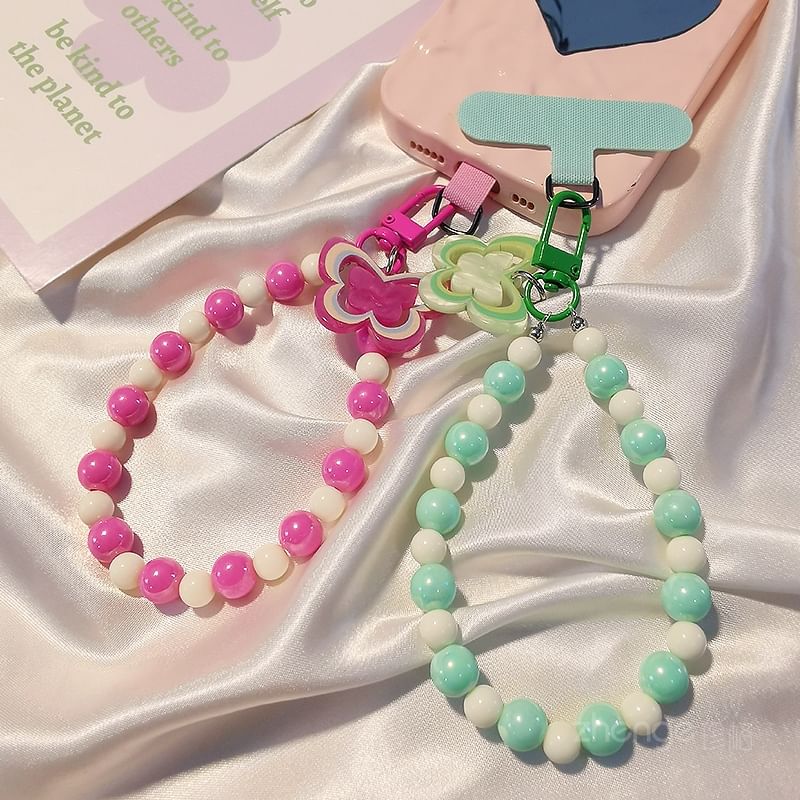 Dragonne de téléphone en perles papillon avec coussinet de lanière