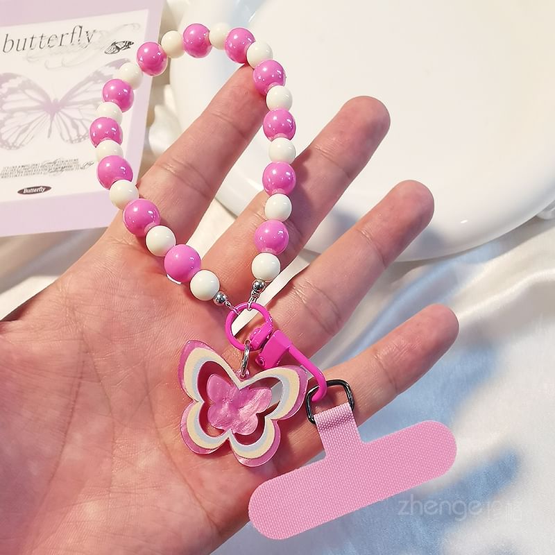 Dragonne de téléphone en perles papillon avec coussinet de lanière