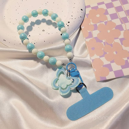 Dragonne de téléphone en perles papillon avec coussinet de lanière