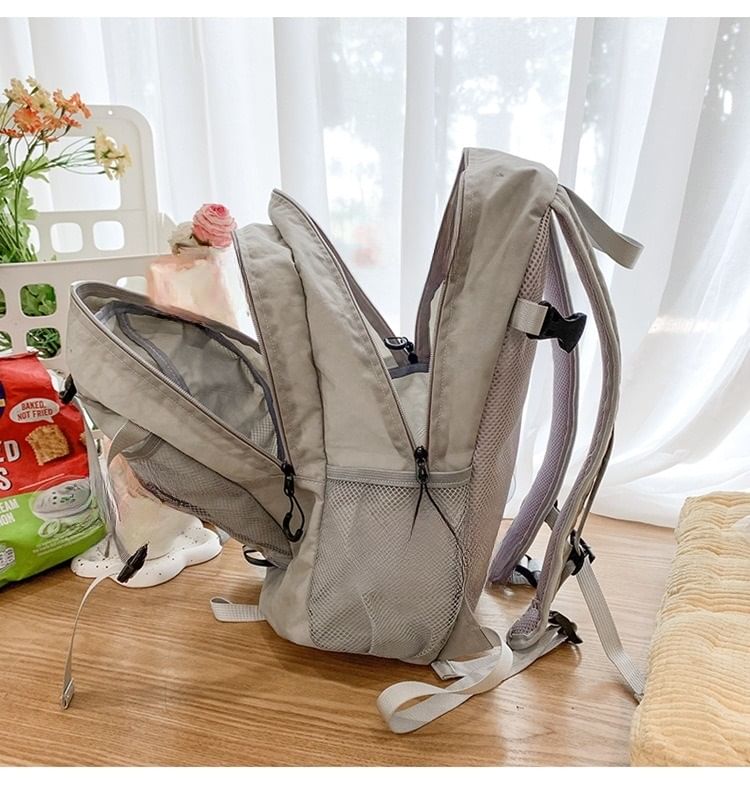 Multi-Pocket Star Mesh Panel Backpack Print