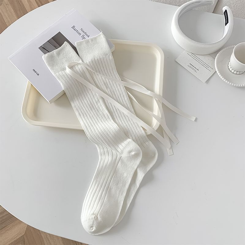Chaussettes hautes unies à nœud