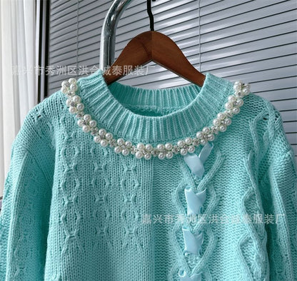 Pull col rond avec ruban et fausses perles