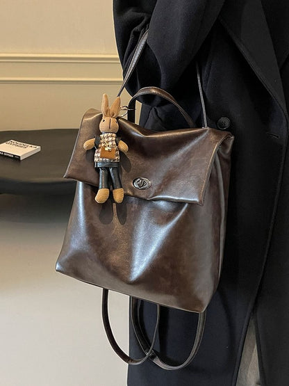 Flap With Charm Faux Leather Backpack