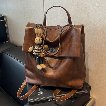 Flap With Charm Faux Leather Backpack