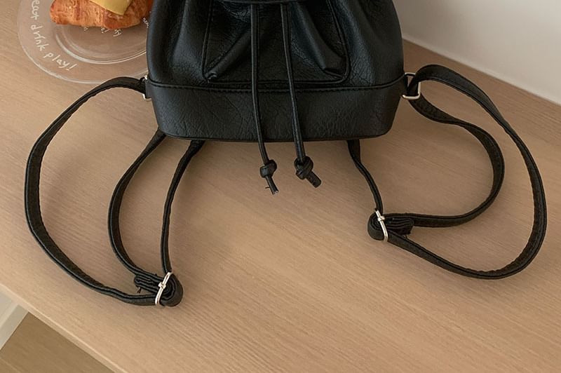Leather Flap Faux Backpack